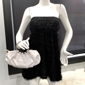 White purse with metal round handle